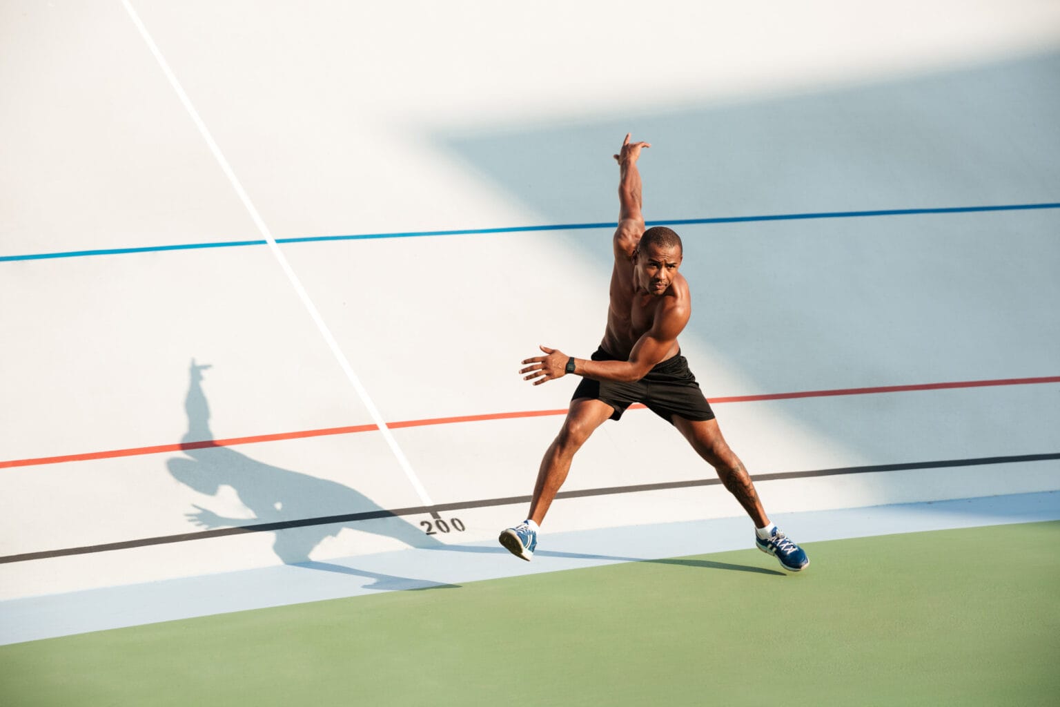 Full length portrait of a half naked muscular sportsman